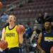 Michigan senior Blake McLimans sticks his tongue out as he juggles basketballs during an open practice at the Palace on Tuesday, March 20, 2013 in Auburn Hills.  Melanie Maxwell I AnnArbor.com